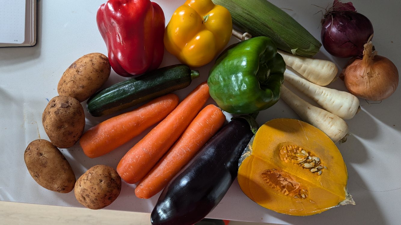 four potatoes, three capsicum, one zucchini, three carrots, one eggplant, on quarter pumpkin, three parsnips, two onions