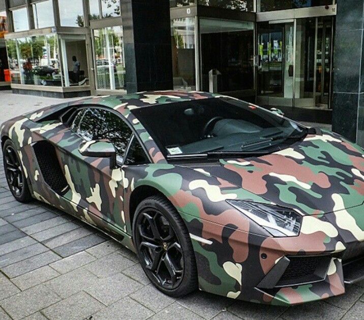 An image of a car painted in army camouflage