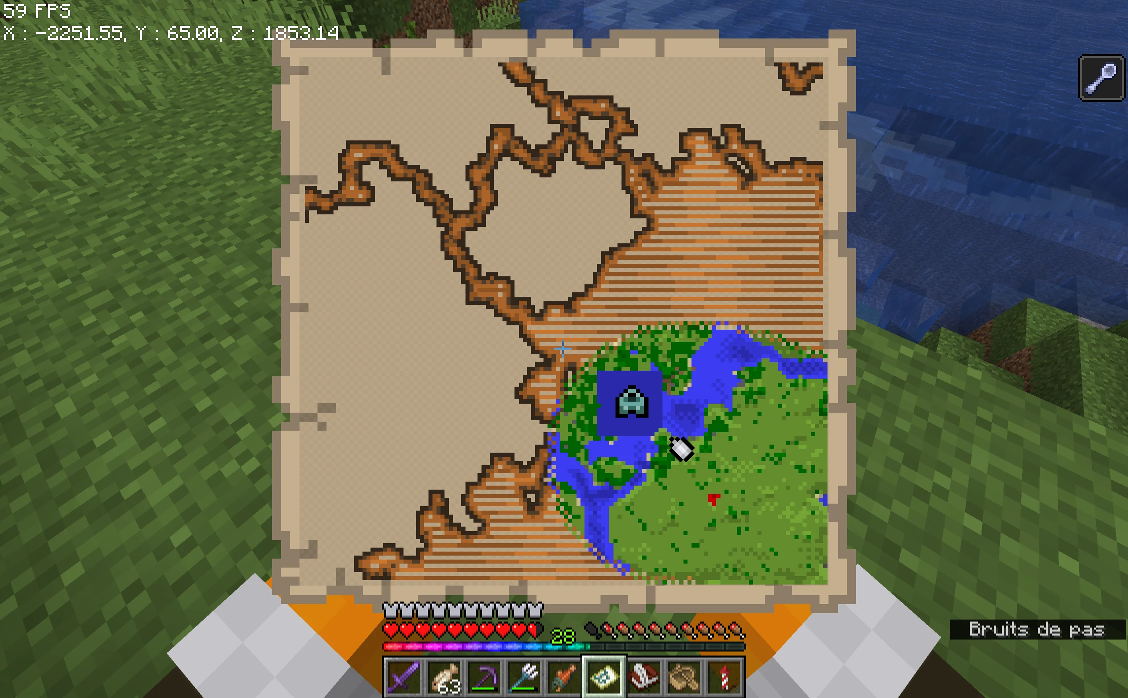 A Minecraft screenshot of a player holding an ocean explorer map. It is barely explored, however we can see that there is a big blue square surrounding the monument, and that the outline of the unexplored terrain does not match the outline of the explored terrain.