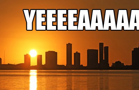 A picture of the Miami skyline seen from the water with the text "YEEEEAAAA" continuing off the right edge of the image.