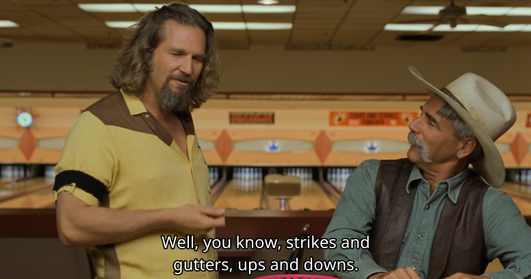 screenshot of The Big Lebowski at 1:50:35 with The Dude talking to The Stranger at the bowling alley, with the subtitle "Well, you know, strikes and gutters, ups and downs."