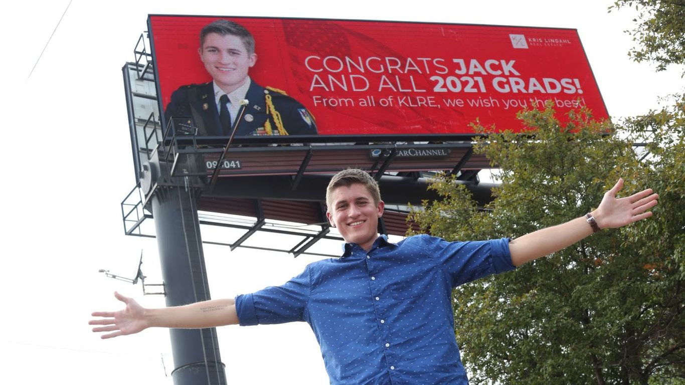 Teen standing in front of Lindahl sign