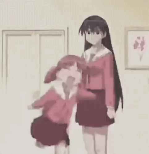GIF of Chiyo from the show "Azumanga Daioh" jumping around eratically while Sakaki stands still next to her