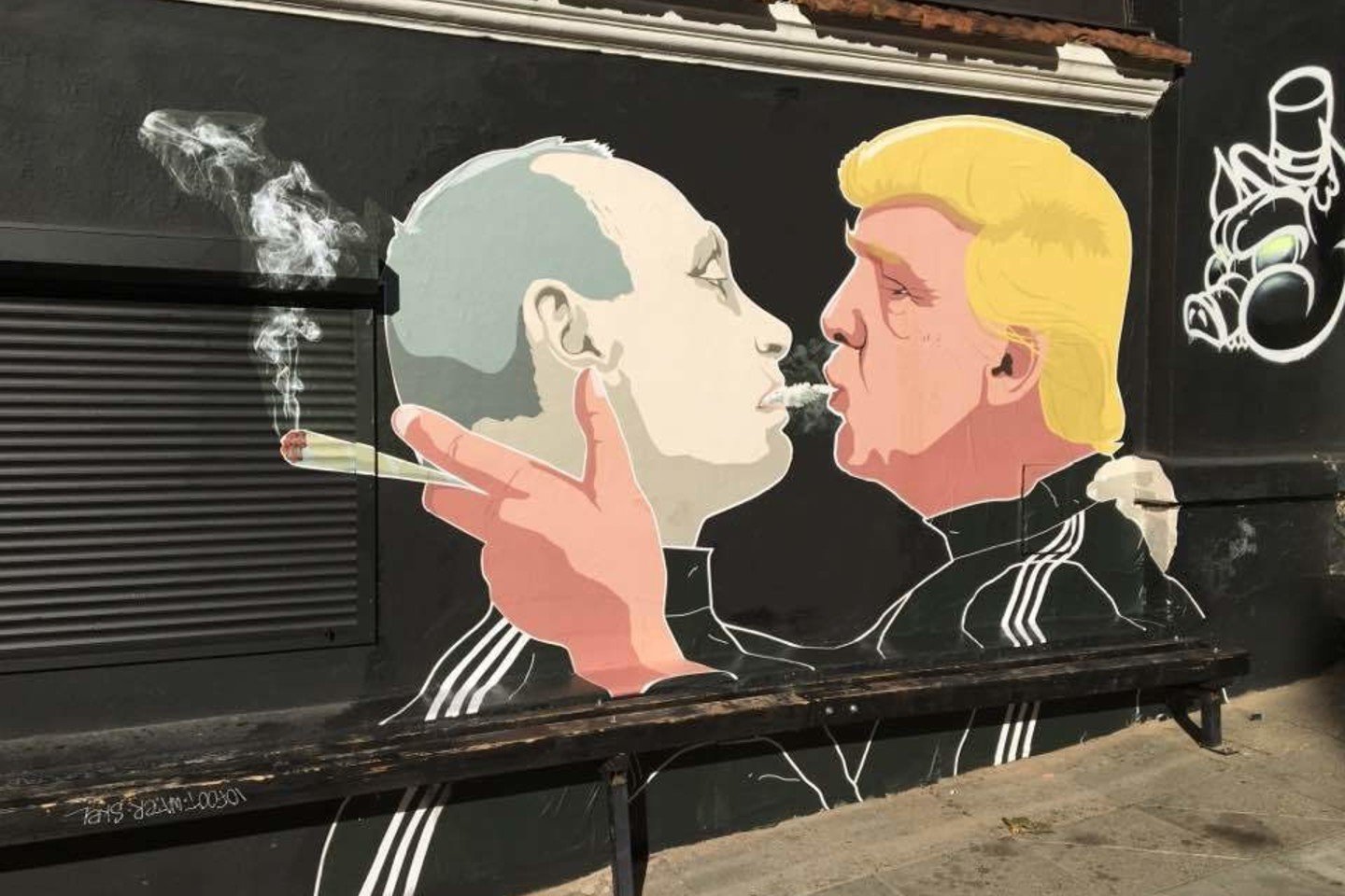 relevant photo of a mural with Putin and Trump kissing