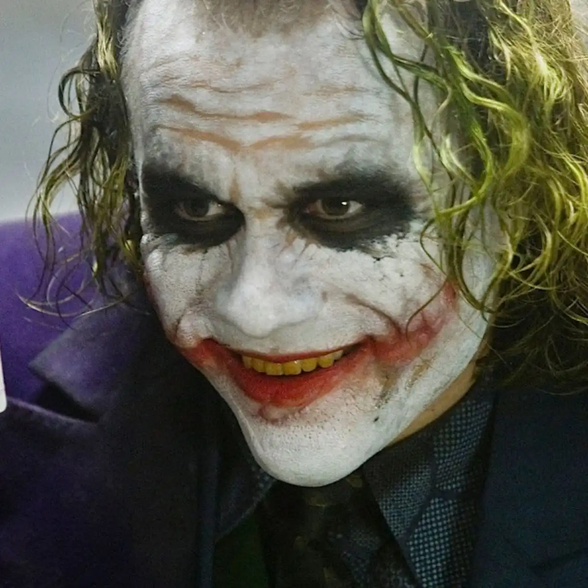 The Joker asks ' Do you wanna know how I got these scars?'