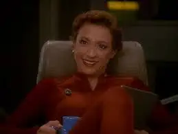 Kira Nerys smiling at you drinking a mug of Raktajino