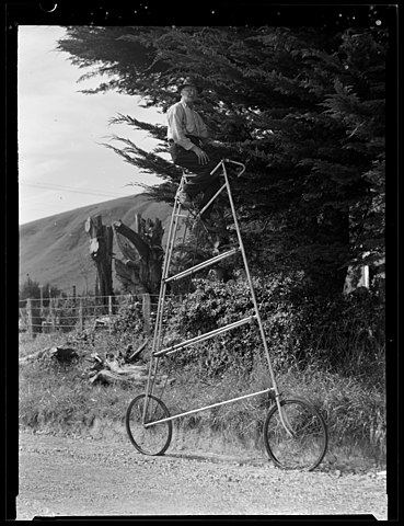 A man on a tall bicycle in rural New Zealand, 1949