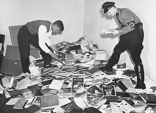 German students and Nazi SA members plunder the library of Magnus Hirschfeld, director of the institute.