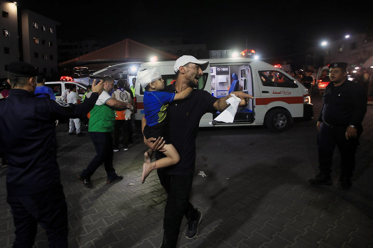 Palestinians rush to bring the wounded, including many children, to Al-Shifa Hospital in Gaza City as Israeli forces continue pounding the Gaza Strip, October 11, 2023. (Mohammed Zaanoun/Activestills)